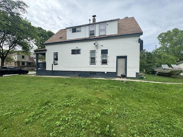 2768 N 34th St, Milwaukee, WI 53210 - back of house featuring a lawn and a chimney