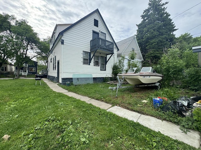 2768 N 34th St, Milwaukee, WI 53210 - view of side of home featuring a balcony and a lawn