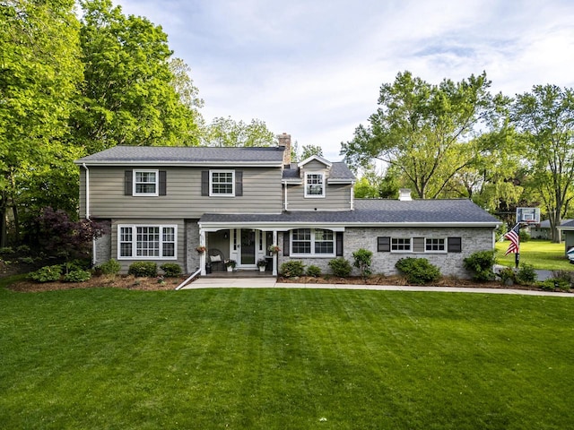 18005 Lisa Ln, Brookfield, WI 53045 - traditional-style home with a chimney, a front yard, and a patio