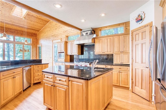 11053 Robin Ln, Hayward, WI 54843 - kitchen with dishwasher, wall chimney range hood, healthy amount of natural light, a kitchen island with sink, and lofted ceiling