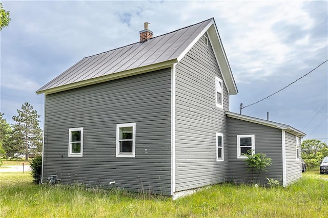 W9952 State Highway 54, Black River Falls, WI 54615 - view of side of home featuring a chimney