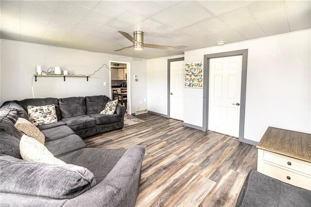 W9952 State Highway 54, Black River Falls, WI 54615 - living area featuring wood finished floors, ceiling fan, and baseboards