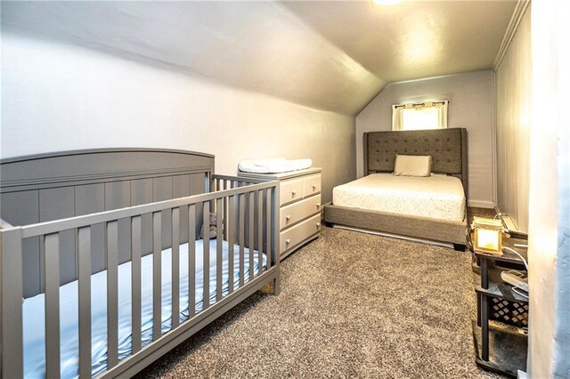 W9952 State Highway 54, Black River Falls, WI 54615 - bedroom featuring carpet flooring, vaulted ceiling, and a crib