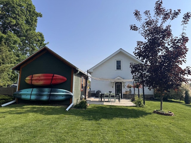 405 W Washington St, Waterford, WI 53185 - back of property with a patio area and a yard