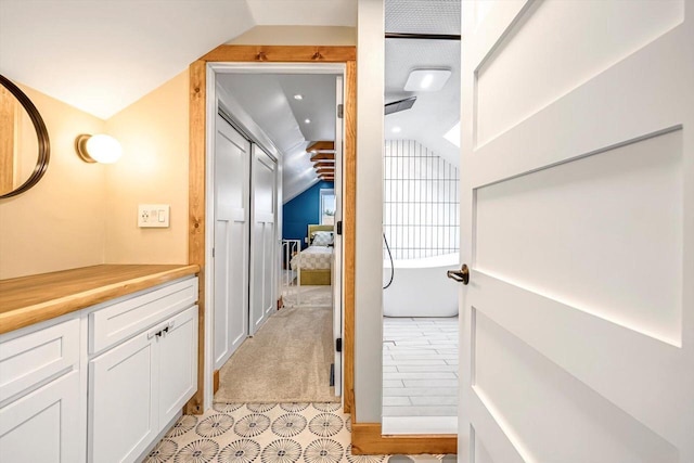 405 W Washington St, Waterford, WI 53185 - corridor with vaulted ceiling and light tile patterned floors
