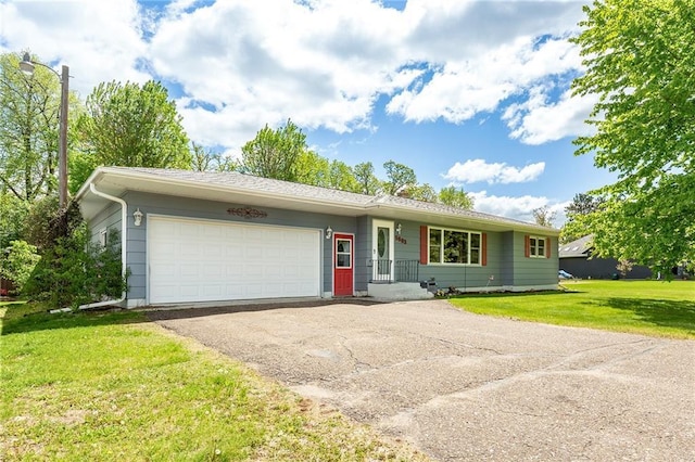 5603 170th St, Chippewa Falls, WI 54729 - ranch-style house featuring a garage, asphalt driveway, and a front lawn
