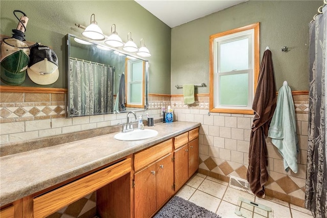 5603 170th St, Chippewa Falls, WI 54729 - bathroom with vanity, tile walls, tile patterned floors, and wainscoting