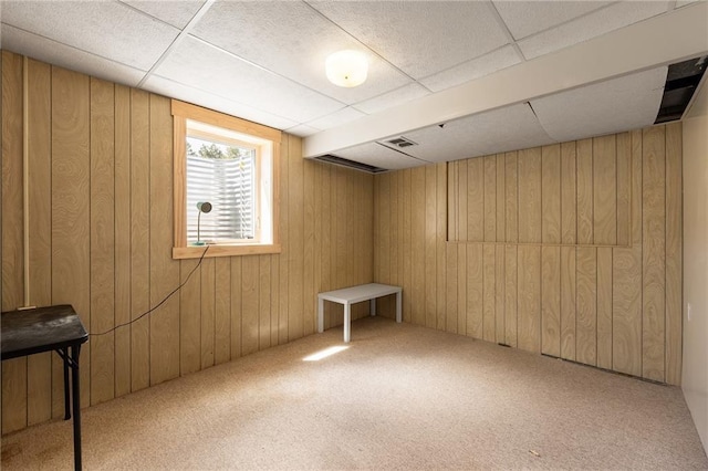 5603 170th St, Chippewa Falls, WI 54729 - basement featuring wood walls, carpet, and a paneled ceiling