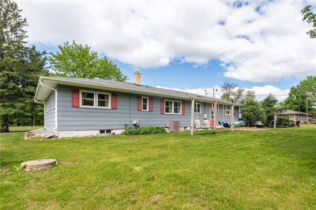 5603 170th St, Chippewa Falls, WI 54729 - rear view of property featuring a chimney and a lawn