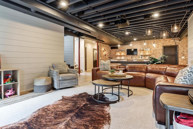 1102 Eldon Way, Edgerton, WI 53534 - living area with brick wall and bar