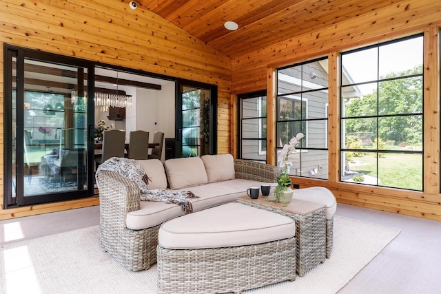 1102 Eldon Way, Edgerton, WI 53534 - living room featuring healthy amount of natural light, vaulted ceiling, wooden ceiling, and wooden walls