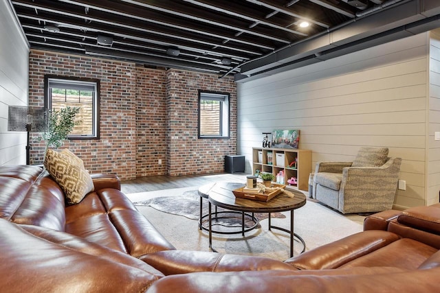 1102 Eldon Way, Edgerton, WI 53534 - living area featuring wood finished floors and brick wall