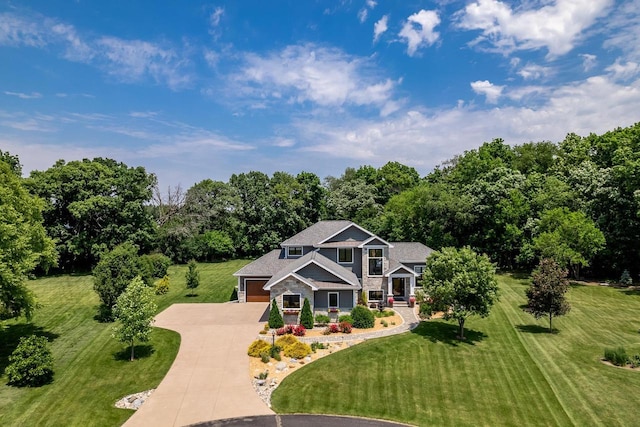 1102 Eldon Way, Edgerton, WI 53534 - craftsman-style house with concrete driveway and a front lawn