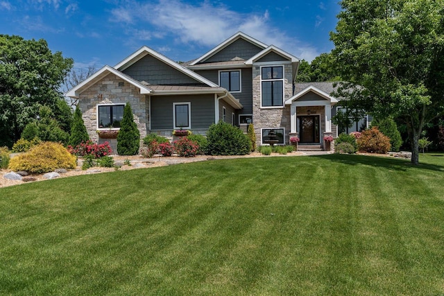 1102 Eldon Way, Edgerton, WI 53534 - craftsman house featuring stone siding and a front lawn