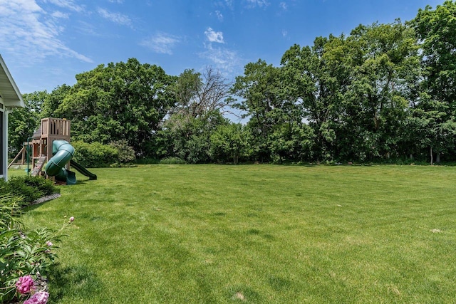 1102 Eldon Way, Edgerton, WI 53534 - view of green lawn featuring a playground