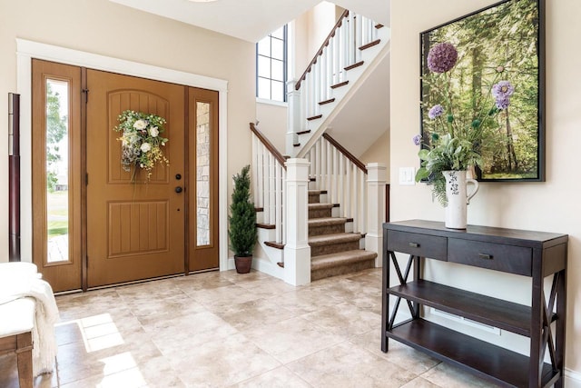 1102 Eldon Way, Edgerton, WI 53534 - foyer entrance featuring stairs and baseboards