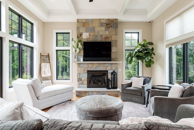 1102 Eldon Way, Edgerton, WI 53534 - living room featuring a fireplace, beam ceiling, plenty of natural light, coffered ceiling, and crown molding