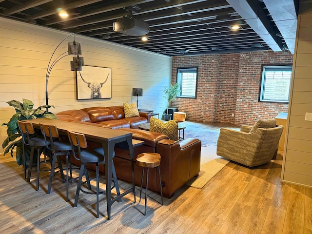 1102 Eldon Way, Edgerton, WI 53534 - interior space featuring wood finished floors, plenty of natural light, and brick wall