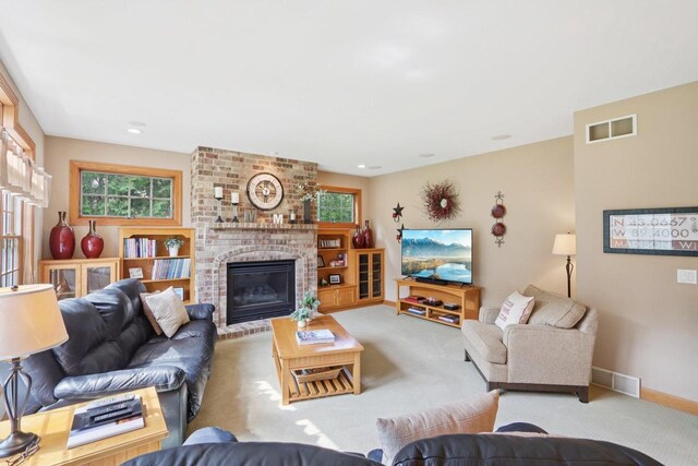 3944 Caribou Rd, Verona, WI 53593 - carpeted living area with plenty of natural light and a brick fireplace