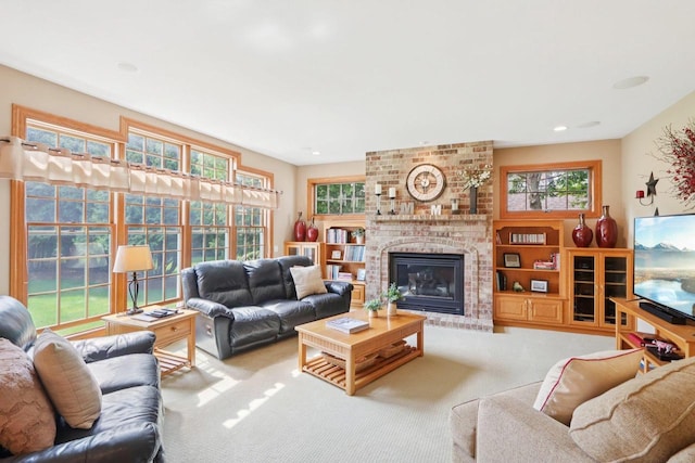 3944 Caribou Rd, Verona, WI 53593 - carpeted living area featuring a brick fireplace and recessed lighting