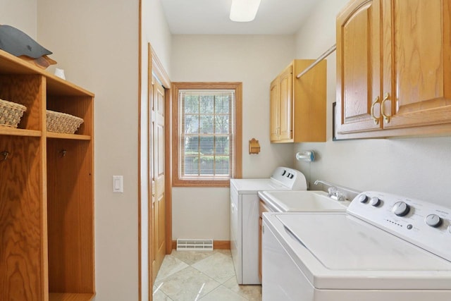 3944 Caribou Rd, Verona, WI 53593 - washroom featuring cabinet space, separate washer and dryer, and light tile patterned flooring