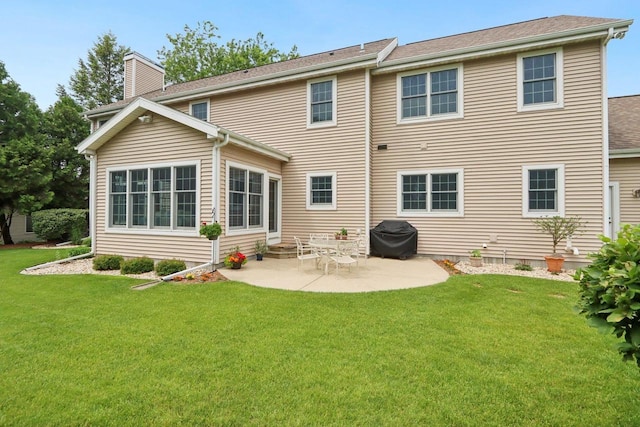 3944 Caribou Rd, Verona, WI 53593 - rear view of house featuring a patio, a chimney, and a yard