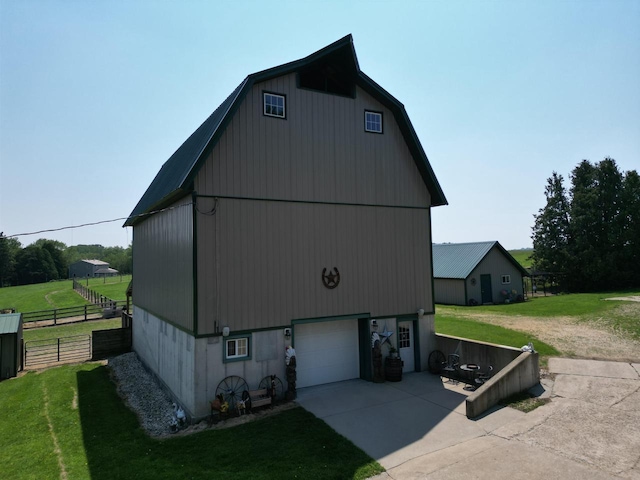 3213 W County M Rd, Edgerton, WI 53534 - view of outdoor structure with driveway and an attached garage