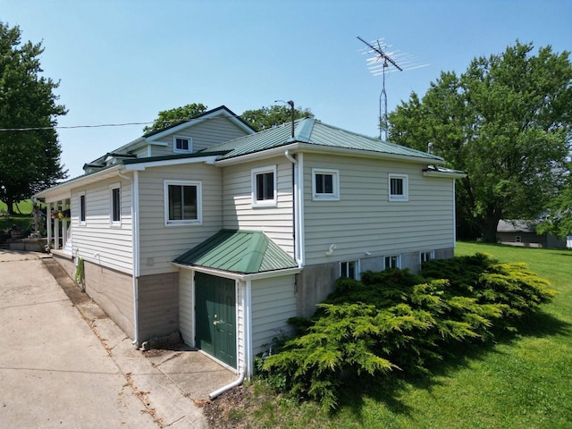 3213 W County M Rd, Edgerton, WI 53534 - view of home's exterior with metal roof and a yard