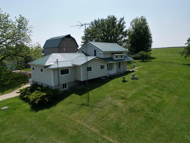 3213 W County M Rd, Edgerton, WI 53534 - view of property exterior featuring a yard, metal roof, and a barn