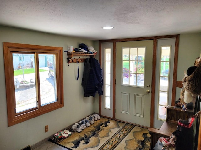 3213 W County M Rd, Edgerton, WI 53534 - entrance foyer featuring a textured ceiling
