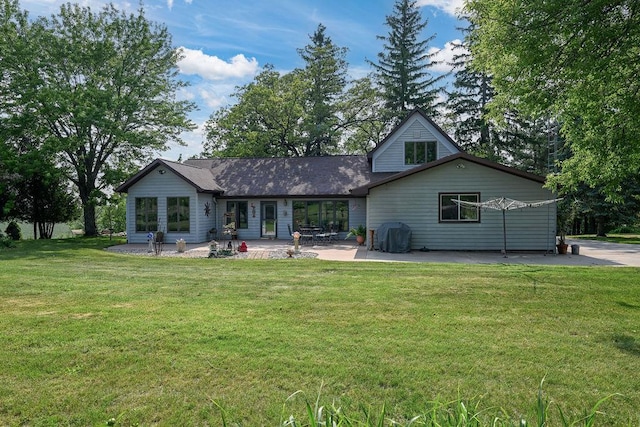 7129 S County Road Jj, Bancroft, WI 54921 - rear view of house with a patio area and a lawn