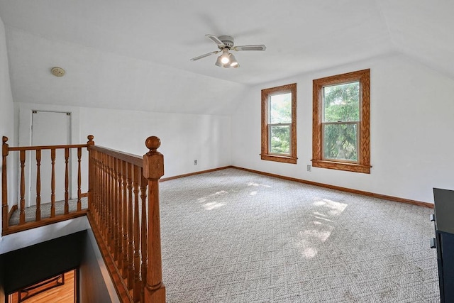 7129 S County Road Jj, Bancroft, WI 54921 - bonus room featuring vaulted ceiling, carpet flooring, a ceiling fan, and baseboards