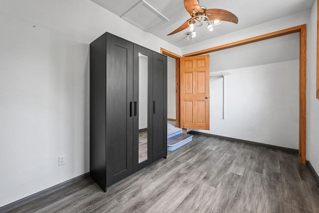 7129 S County Road Jj, Bancroft, WI 54921 - unfurnished bedroom featuring wood finished floors, a ceiling fan, and baseboards