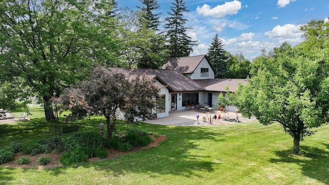 7129 S County Road Jj, Bancroft, WI 54921 - back of house with a patio and a lawn