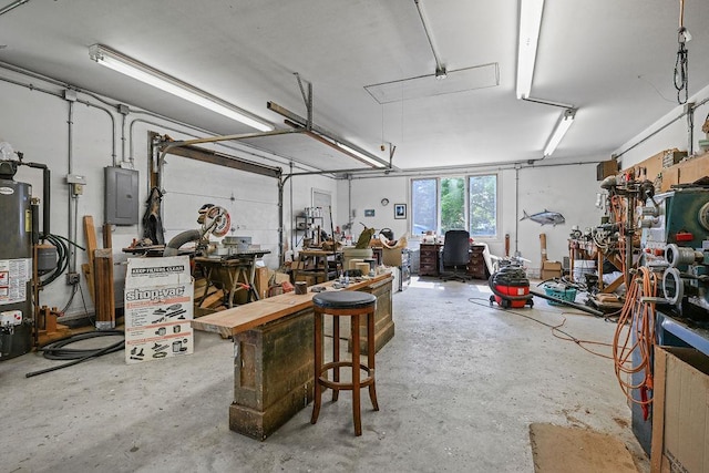 7129 S County Road Jj, Bancroft, WI 54921 - garage with electric panel, water heater, and a workshop area