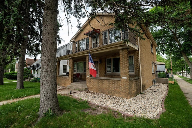 3161 N 76th St Unit 3161A, Milwaukee, WI 53222 - view of front facade featuring brick siding and a porch