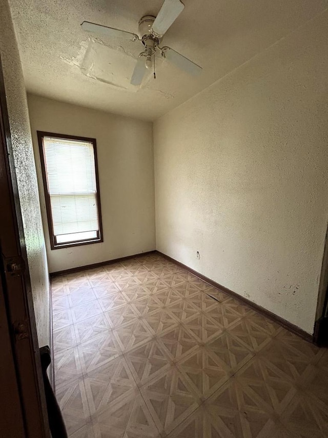 1218 W Locust St, Milwaukee, WI 53206 - spare room featuring ceiling fan, baseboards, and a textured wall