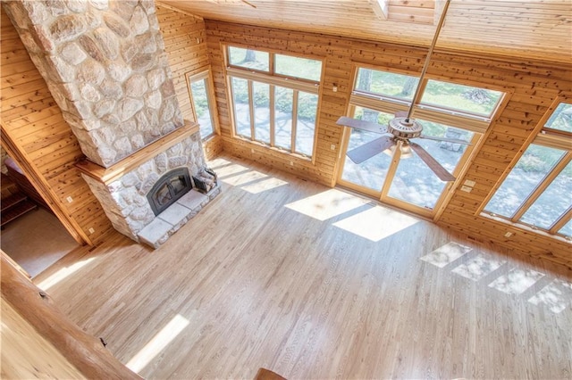 11053 N Robin Ln, Hayward, WI 54843 - unfurnished living room featuring wood finished floors, a ceiling fan, wood walls, and wooden ceiling