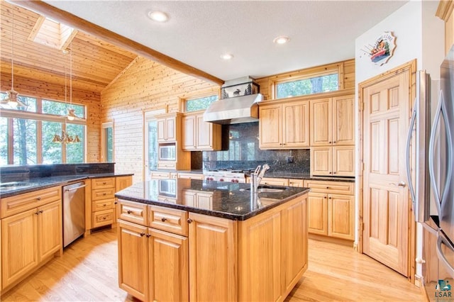 11053 N Robin Ln, Hayward, WI 54843 - kitchen featuring dishwasher, wall chimney range hood, healthy amount of natural light, a kitchen island with sink, and vaulted ceiling