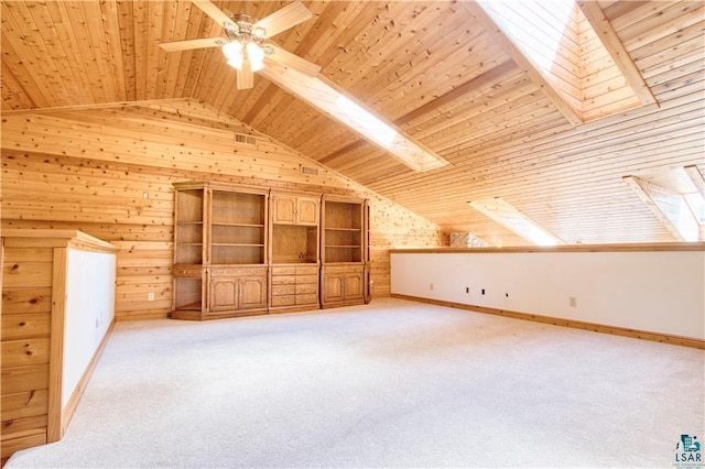 11053 N Robin Ln, Hayward, WI 54843 - bonus room with lofted ceiling, wooden ceiling, wood walls, ceiling fan, and light carpet