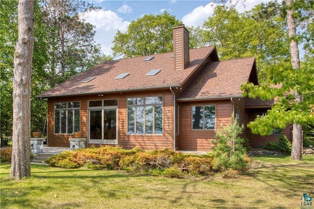 11053 N Robin Ln, Hayward, WI 54843 - back of property with a yard, a chimney, and a shingled roof