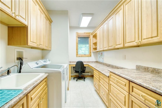 11053 N Robin Ln, Hayward, WI 54843 - laundry area featuring separate washer and dryer, cabinet space, light tile patterned flooring, and a desk