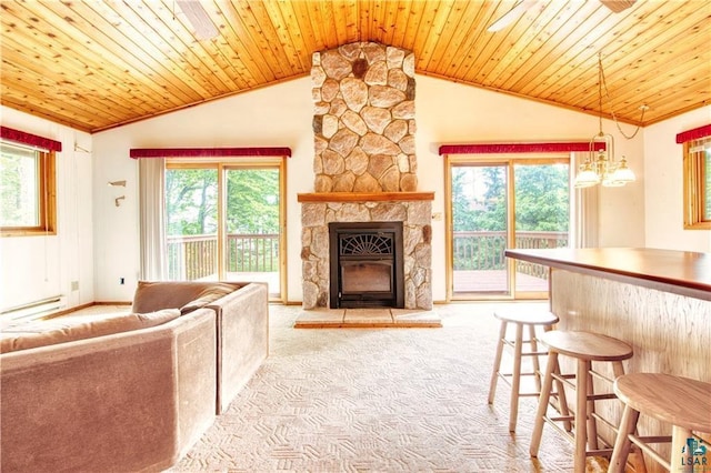 11053 N Robin Ln, Hayward, WI 54843 - living area with carpet, lofted ceiling, a baseboard radiator, a fireplace, and wooden ceiling