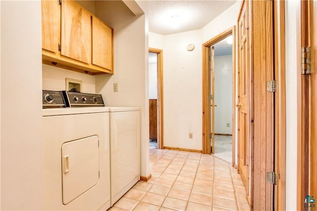 11053 N Robin Ln, Hayward, WI 54843 - laundry area with cabinet space, washer and clothes dryer, light tile patterned flooring, and a textured ceiling