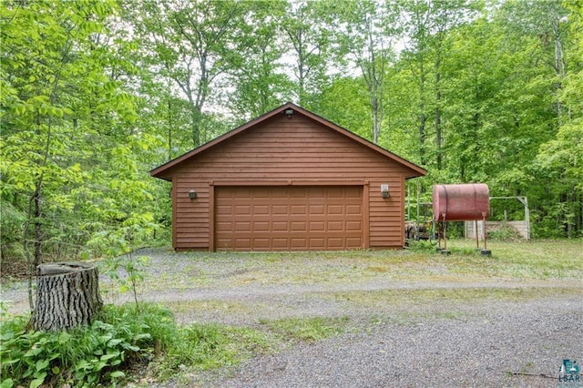 11053 N Robin Ln, Hayward, WI 54843 - detached garage featuring a view of trees