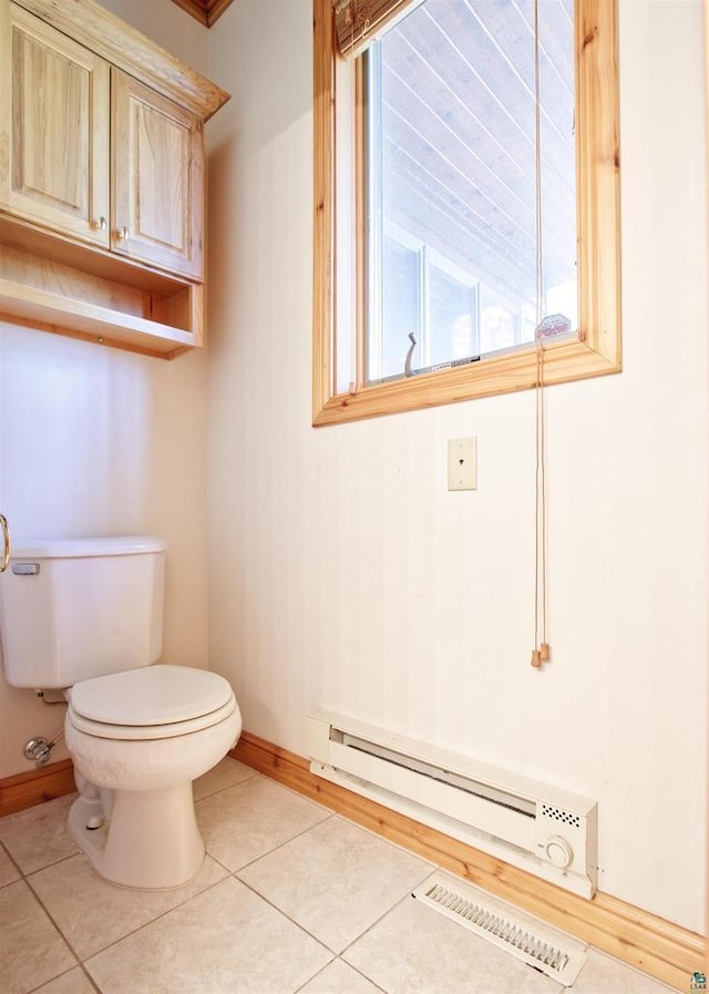11053 N Robin Ln, Hayward, WI 54843 - bathroom featuring a baseboard radiator, baseboards, toilet, and tile patterned flooring