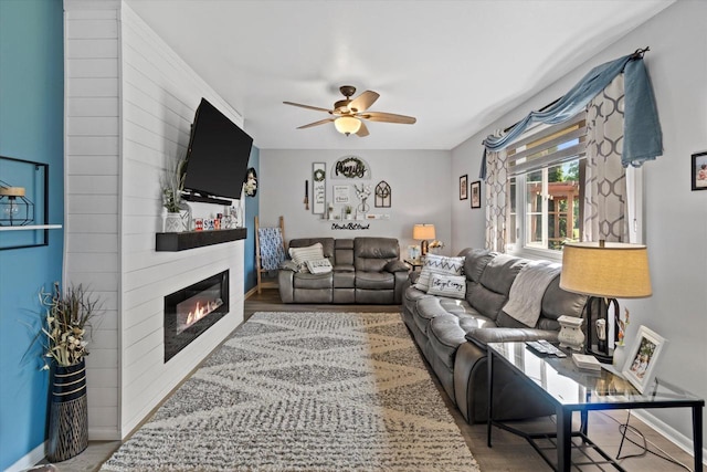 3433 Illinois St, Mount Pleasant, WI 53405 - living room featuring ceiling fan, a large fireplace, wood finished floors, and baseboards