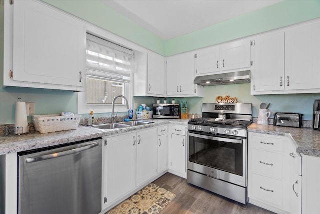 3433 Illinois St, Mount Pleasant, WI 53405 - kitchen with appliances with stainless steel finishes, under cabinet range hood, a sink, white cabinetry, and light countertops