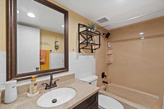 3433 Illinois St, Mount Pleasant, WI 53405 - bathroom with toilet, vanity, shower / bathtub combination, and tile walls