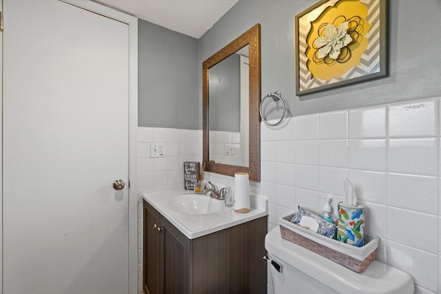 3433 Illinois St, Mount Pleasant, WI 53405 - half bath featuring tile walls, toilet, and vanity